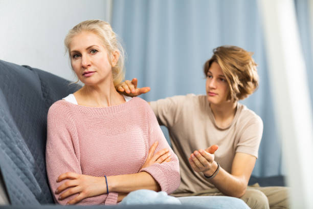 istock Mother and son sitting after quarrel at home 1484945769