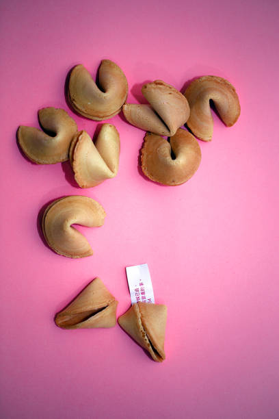 Fortune cookie and blank slip of paper with room for text.