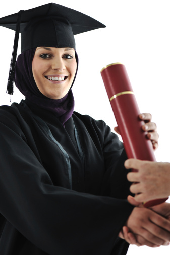 Young arabic muslim female graduating and receiving diploma