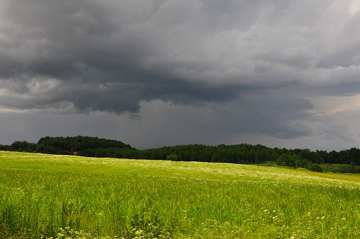 Sun and clouds. Landscape before the storm. Field. Olsztyn area. Poland - Masuria - Warmia.
