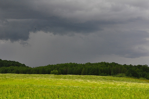 Storm clouds with sunlight. Olsztyn area. Poland - Masuria - Warmia.