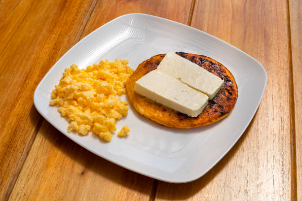 istock Arepa chocolo with cheese and egg - Traditional Colombian breakfast 1484952927