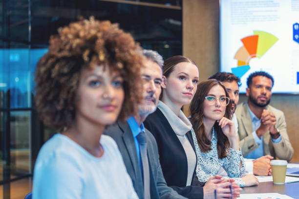 istock Group of people listening to a presentation. 1484956149