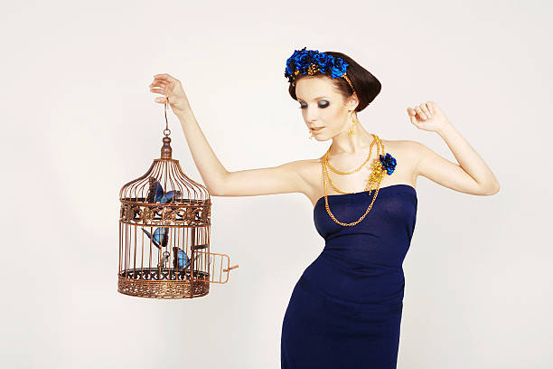 istock Girl holding a cage with butterflies 148495814