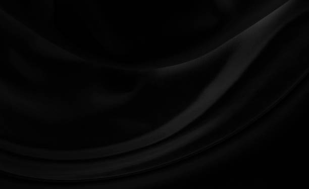 istock Black gray satin dark fabric texture luxurious shiny that is abstract silk cloth background with patterns soft waves blur beautiful. 1484958354