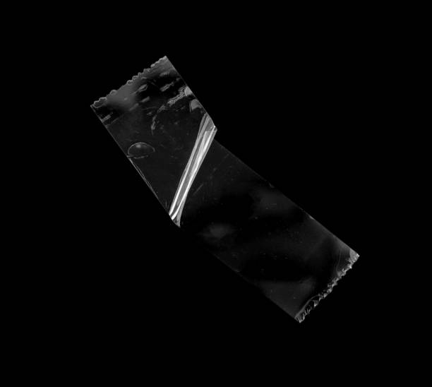 istock adhesive plastic tape isolated on black background 1484959314