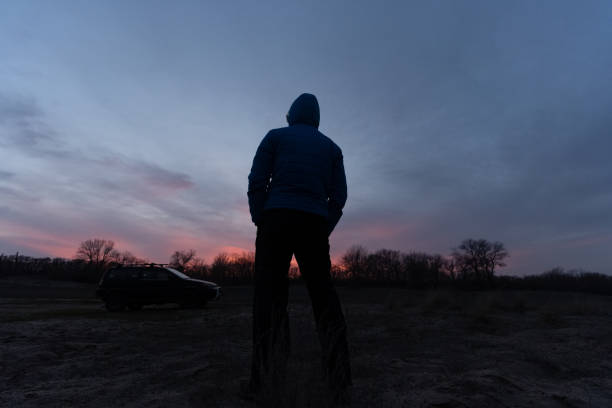 istock People and nature. Man at seaside at dusk. copy space 1484959455