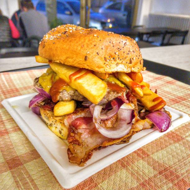 istock Group of double hamburgers stuffed with fresh beef cheddar cheese, egg, crispy bacon, peppers and onion. Best burger for fast food. 1484961569
