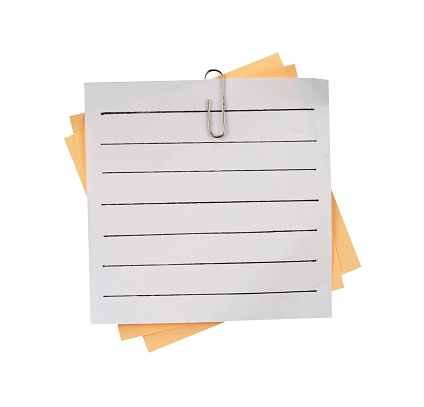 stack of note paper with clip isolated