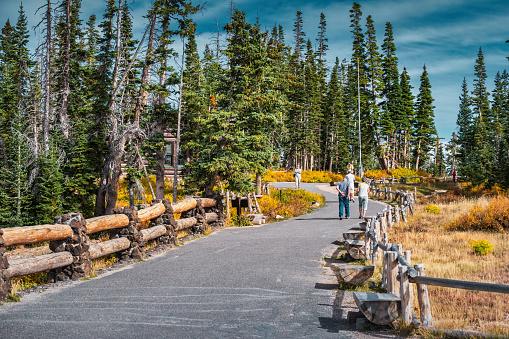 Visitors walk in Cedar Breaks National Monument, Utah, USA on a sunny day.