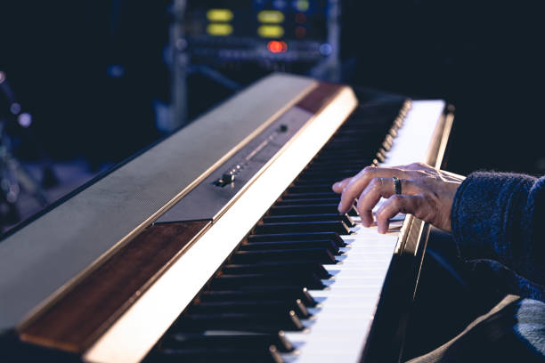 istock A man plays the electronic piano, hands close-up. 1484970408