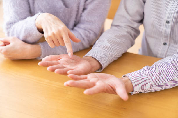 istock senior age couple , palmistry 1484976158