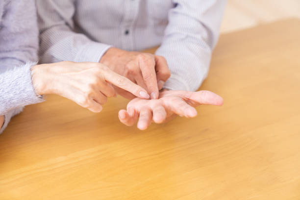 istock senior age couple , palmistry 1484976363