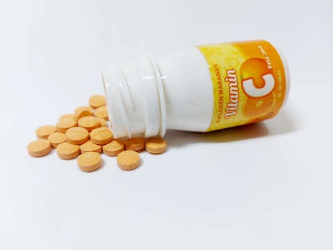 A bottle of vitamin C, photographed in April 2023 in Indonesia. This is a supplement medicine to maintain the human body's immunity.