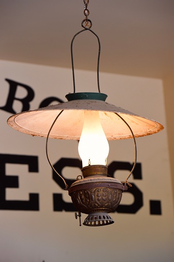 Antique bass lamp hanging from the ceiling