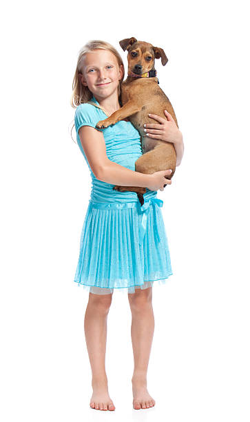 istock Young Girl Holding her Dog 148498690