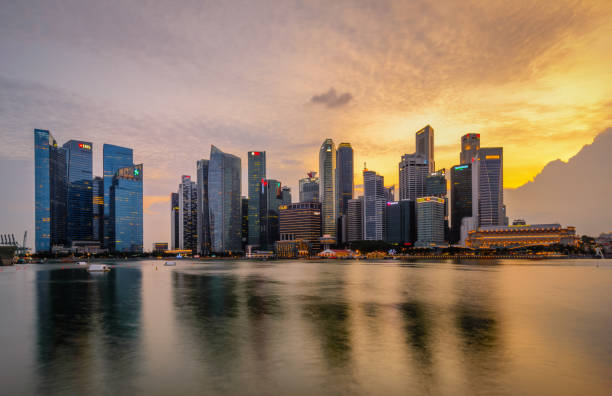 istock Vibrant sunset panorama background of central business district with perfect reflection 1484990346