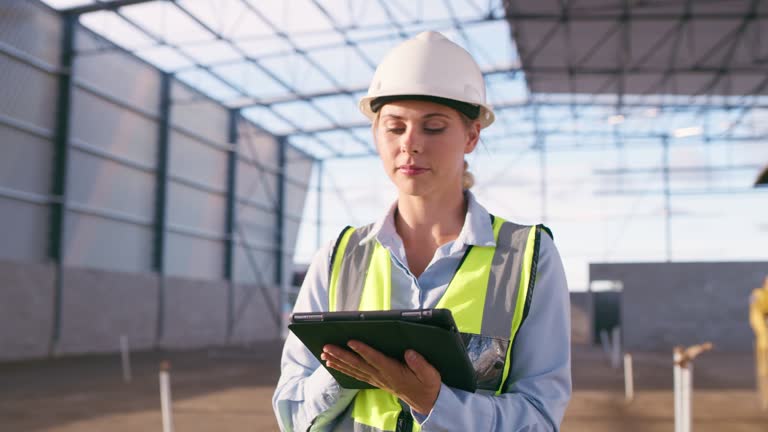 Serious woman, construction ideas and tablet at site for project management, building logistics or app. Thinking, female and engineering worker on digital technology at industrial architecture design