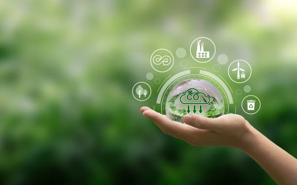 istock Hand holding crystal globe with a CO2 icon.Sustainable development and green business. Reduce CO2 emission concept. Renewable energy-based green businesses can limit climate change and global warming. 1485004154
