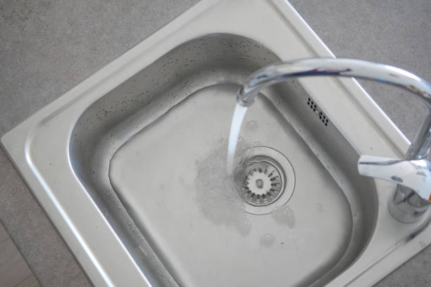 istock top view of faucet with flowing water 1485010797