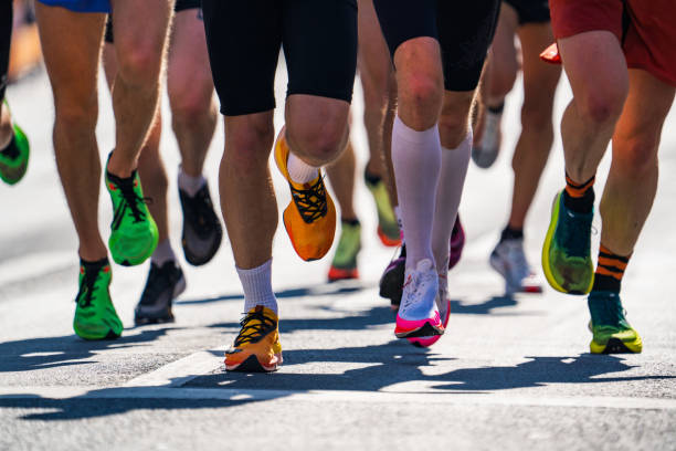 closeup many legs running marathon race