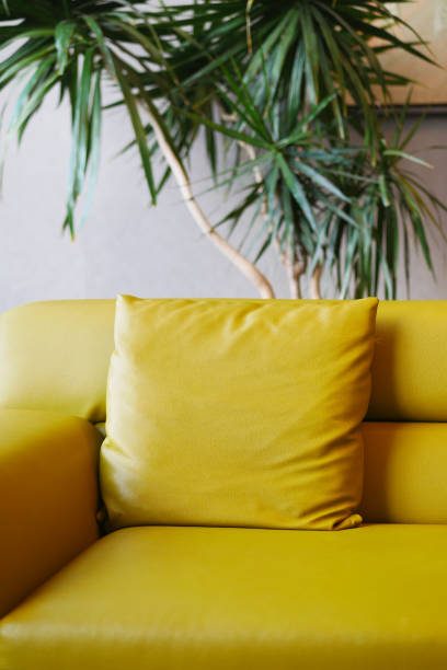 istock modern yellow sofa with pillows in living room at home 1485011938