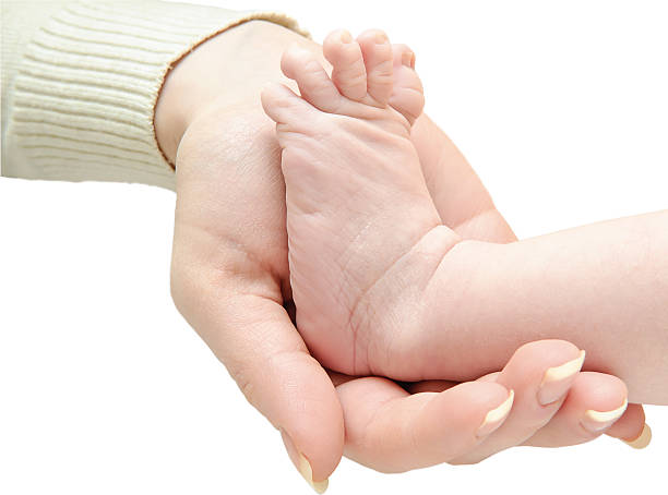 istock baby leg in hand 148501258