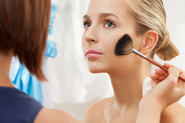 istock removing excess of powder using fan brush 148501374