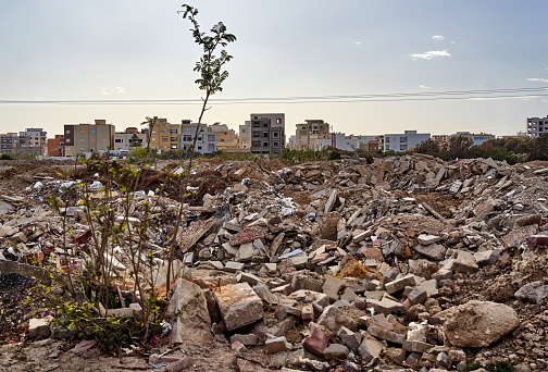 Monastir, Tunisia, January 19, 2023: Heaps of rubble and garbage dumps on the outskirts of a poor suburban settlement in North Africa in Tunisia