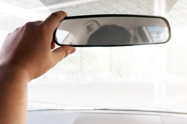istock Man driver adjusting his rearview mirror in the car 1485023517