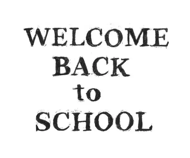 Vector illustration of WELCOME BACK TO SCHOOL text handwritten by black charcoal on white paper background - abstract vector illustration with natural imperfections - chalk chips, dirt, irregular font edges, uneven coloring