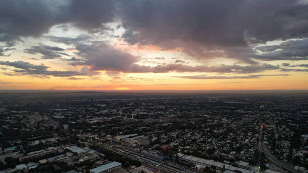 istock Large gray clouds in orange light of sun at sunset 1485024718