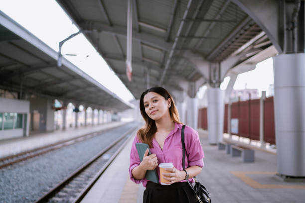 istock Asian Woman Waiting for Rapid Transit While on the Way to Meet Client. 1485025347