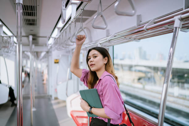 istock Asian Woman Preparing to Get off Rapid Transit as It's Approaching the Station. 1485025577