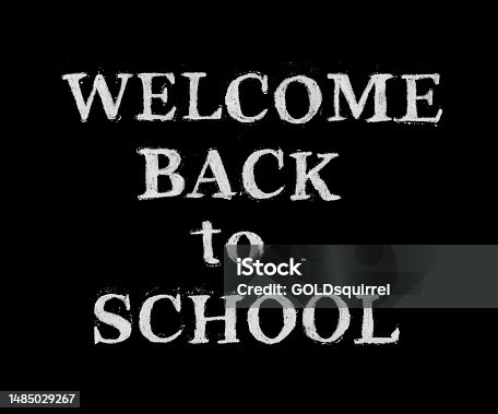 istock Handwritten text WELCOME BACK TO SCHOOL on a black chalkboard - abstract illustration design template with doodled text made by hand and white chalk - original letters with textured effect and scattered crumbs around - vector art 1485029267