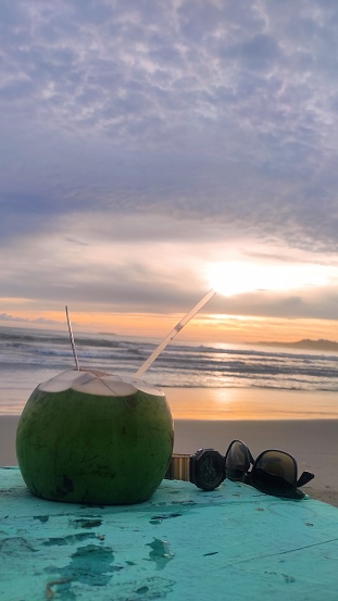 Drink coconut water at beach