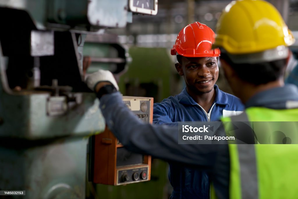 Engineer Fu Technician Engineer In Protective Uniform With Hardhat Standing And ...