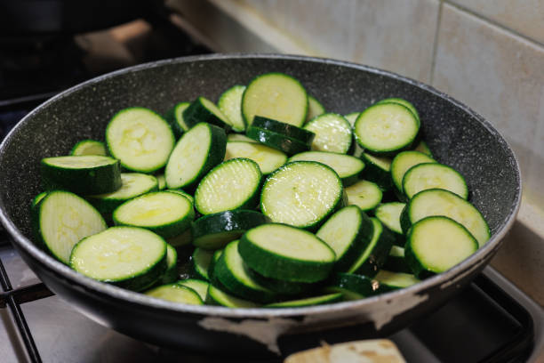 istock Zucchini Cut into Round Slices That Cook in a Small Frying Pan 1485035126