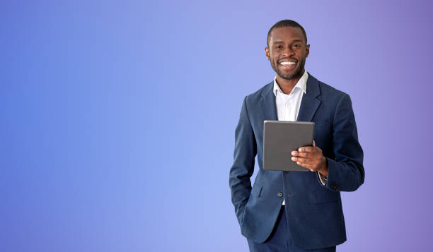 istock African man with tablet, purple background 1485036657