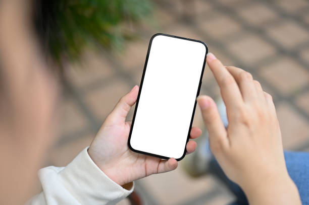 istock Close-up image of an Asian woman using her phone while relaxing in her home backyard 1485039019