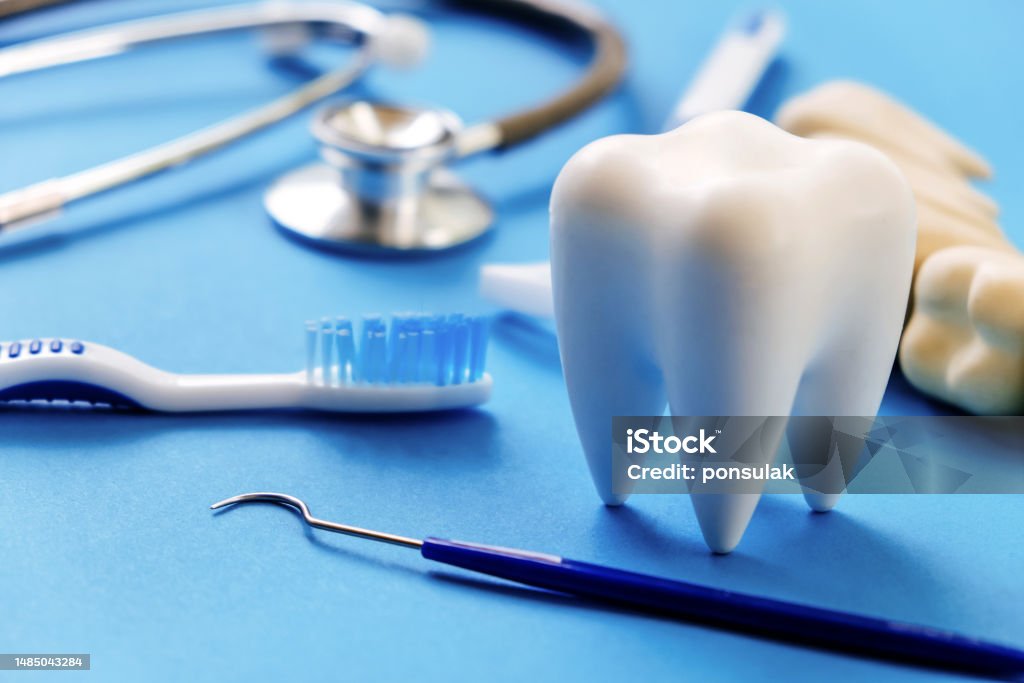 Dentistry concept. Dental model and dental equipment on blue background, Dentistry concept. Dental Health Stock Photo