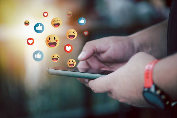 istock Man using smart phone with social media icons pop up from phone. 1485044888