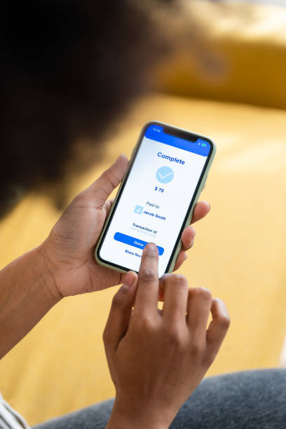 istock Crop faceless woman using smartphone paying online 1485045869
