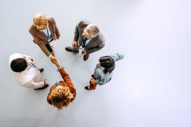 Business partners shaking hands in the office