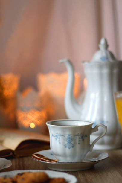 istock Tea, Cookies, Chocolate, Blueberries, Juice, Book and Candles 1485047902