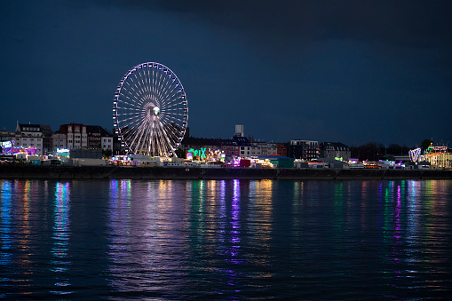 Batumi, Georgia. Ferris wheel on the embankment at night, motion blur filmed