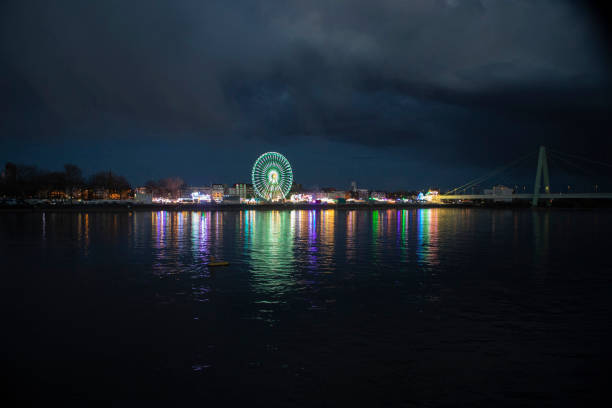 Low Angle View Of Colorful Ferris Wheel Against Clear Sky At Night