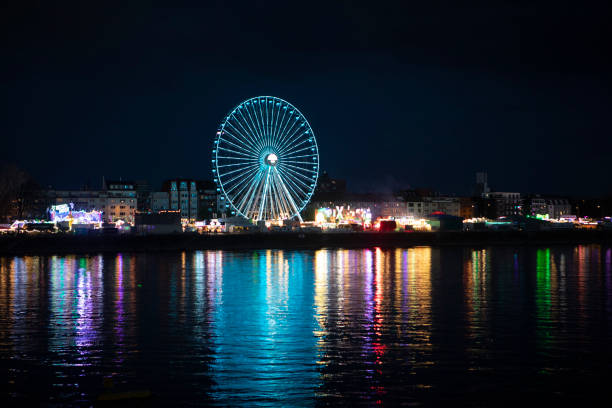 The moon hangs on the Ferris wheel at central