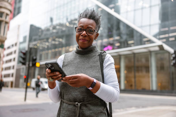 istock Content Senior Adult Black Female Looking At The Camera While Using A Smartphone 1485050012
