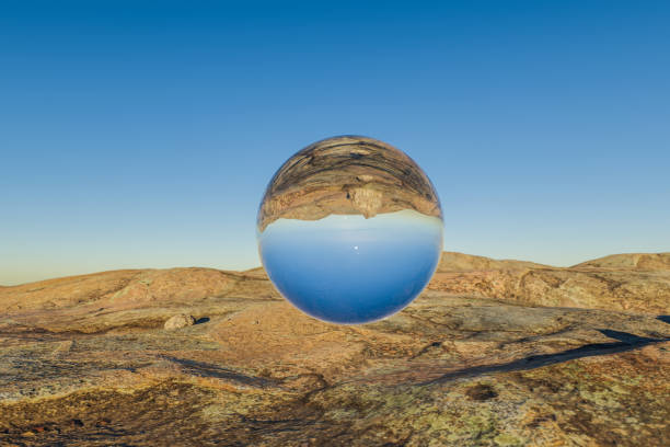 istock single glas sphere ball hovering in the air in large empty desert environment; abstract surreal concept; 3D Illustration 1485050200